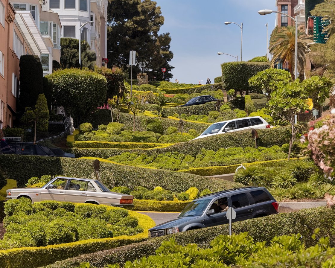 A view of Lombard Street in San Francisco, featuring its winding, flower-lined path surrounded by charming Victorian houses.